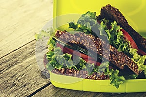 Tasty Healthy Vegetarian Vegan Sandwich in Lunch Box on Wooden T