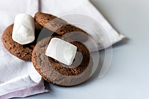 Tasty Homemade Chocolate Chip and Marshmallow Dark Chocolate Cookies on Blue Background Horizontal