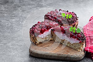 Tasty homemade cranberry tarts on gray