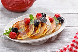 Tasty homemade pancakes with berries