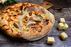 Tasty hot italian focaccia pizza with porcini mushroom