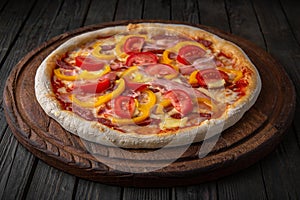 Tasty hot italian pizza with ham, tomato and sweet pepper. Pizzeria menu. Concept poster for Restaurants