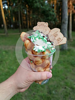 Tasty ice cream with bubble waffle, creame and decorations