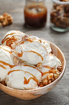 Tasty ice cream with caramel sauce and popcorn