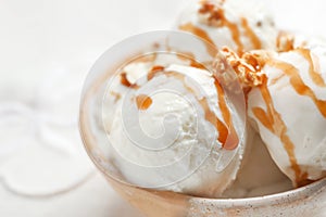 Tasty ice cream with caramel sauce and popcorn