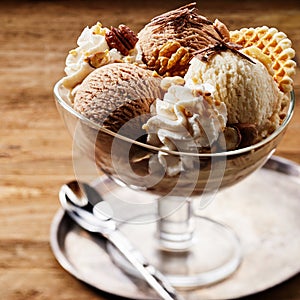 Tasty ice cream dessert in glass bowl