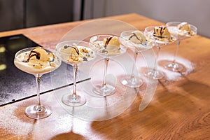 Tasty ice cream dessert made from chocolate and vanilla in glass bowl