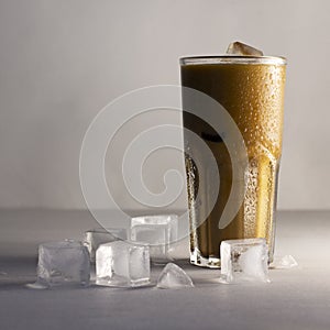 Tasty iced coffee with milk, cold drink in glass