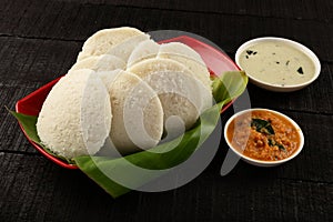 Tasty Idly served with sambar in banana leaf