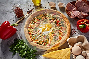 Tasty Italian pizza and its ingredients on white textured background.