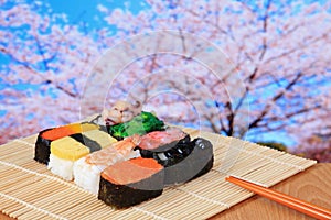 Tasty japan sushi with pink cherry blossoms tree