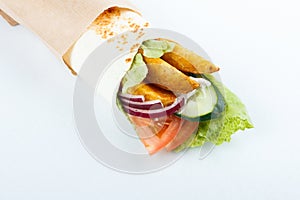 Tasty lavash rolls with potato and vegetables, isolated on white. menu photo