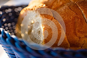 Tasty Loaves Of Traditional Homemade Bread In Blue Wooden Basket