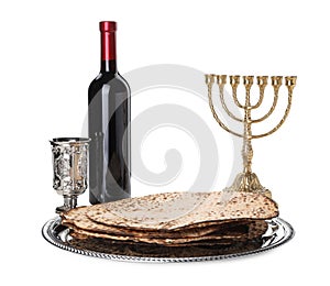 Tasty matzos, wine and menorah on white. Passover Pesach celebration