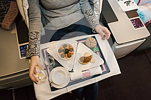 Tasty meal served on board of airplane on the table.