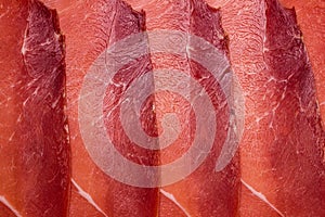 Tasty meat background, thinly sliced jamon