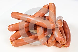 Tasty meat sausages over white background