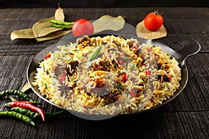 Tasty Mutton biriyani in cast iron cookware