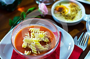 Tasty and nutritious tomato soup with fresh pasta, dietary meal