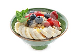 Tasty oatmeal with fresh berries and sliced banana on white background