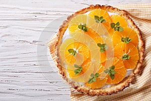 Tasty orange citrus tart with white cream. Horizontal top view