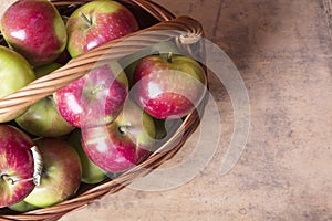 Tasty organic apples in a wicker basket