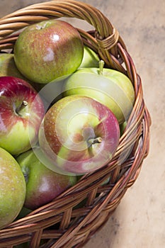 Tasty organic apples in a wicker basket