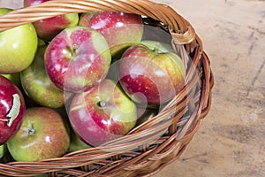 Tasty organic apples in a wicker basket