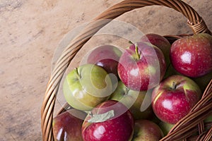 Tasty organic apples in a wicker basket