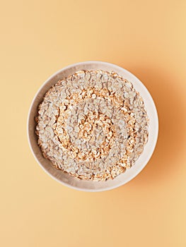 Tasty organic spelt flakes in a bowl