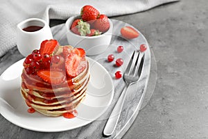 Tasty pancakes with berries served