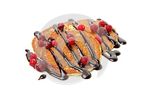 Tasty pancakes with cranberry and sauce isolated on background