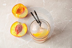 Tasty peach cocktail in glass on table