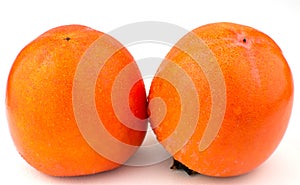 Tasty persimmons kaki fruit on white background