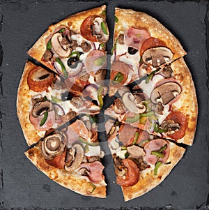 Tasty pizza on black concrete background