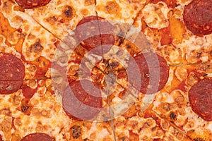 Tasty pizza texture background. Sliced pizza overhead view