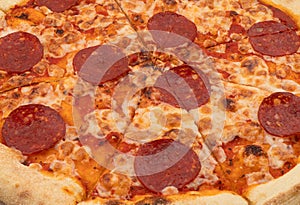 Tasty pizza texture background. Sliced pizza overhead view