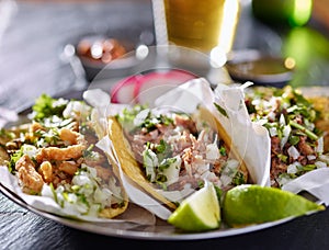 Tasty plate with three authentic mexican tacos