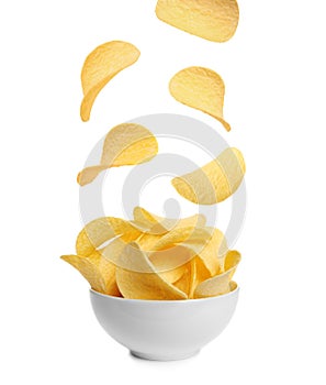 Tasty potato chips falling into blow
