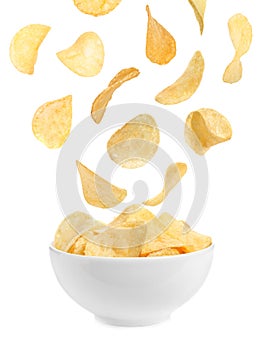 Tasty potato chips falling into blow