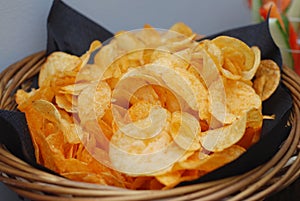 Tasty Potatoe Chips in Basket. Snack Bar. Food.