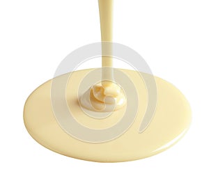 Tasty pouring condensed milk on white. Dairy product