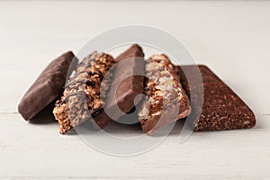 Tasty protein bars on white table.