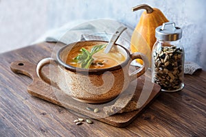 Tasty pumpkin soup on the table