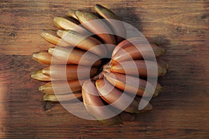 Tasty purple bananas on wooden table, top view photo