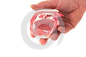 Tasty raw lamb loin chop in a butcher hand. Meat industry. High quality and price product. Food supply industry. Isolated