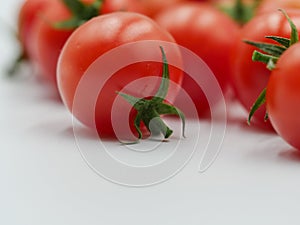 Tasty red cherry tomatoes with shadows