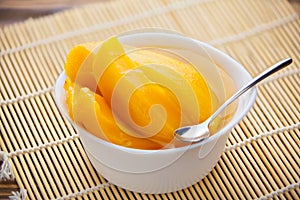 Tasty ripe appetizing mango on  plate on the table