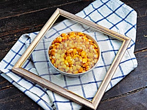 Tasty ripe corn kernels in a bowl.