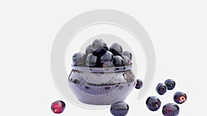 Closeup of Organic Jamun or Black Plum, Syzygium Cumini Isolated on White Background, Also Known as Malabar Plum or Jambolan photo